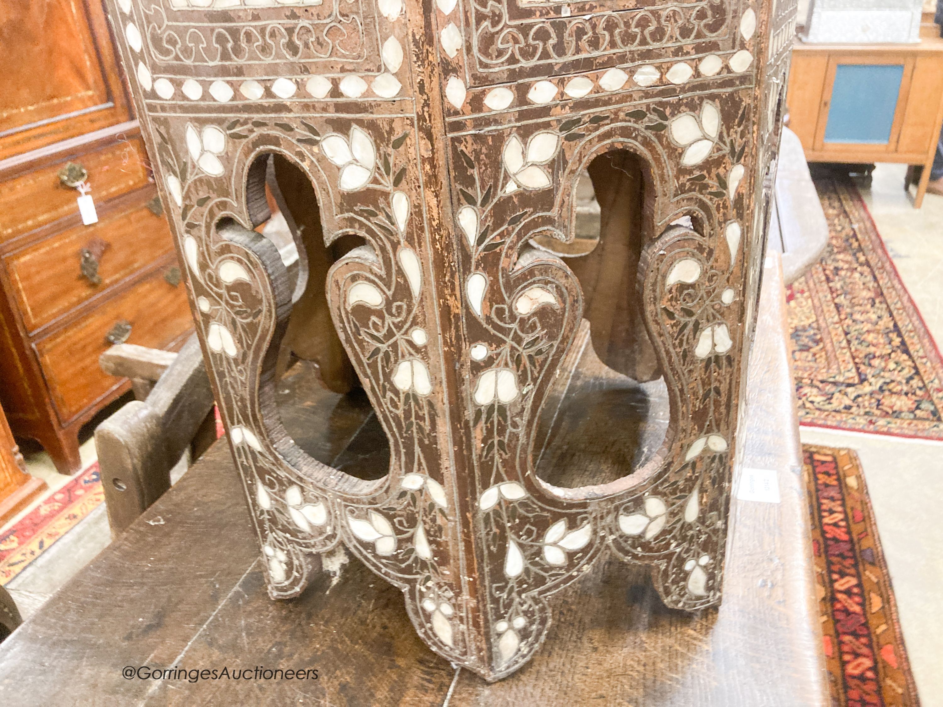 A Middle Eastern mother of pearl and bone inlaid octagonal topped coffee table, width 45cm, height 60cm